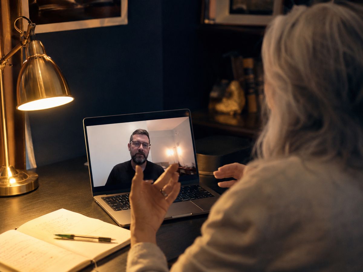 A UK business owner discussing requirements during founder-led onboarding